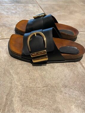 KHAITE Thompson Black Leather Slide Sandals with Gold Buckle